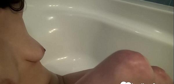  Cute brunette plays with herself before the bath